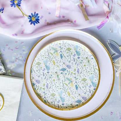 Round decorative plate with floral pattern on a light blue background