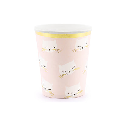 Pink paper cups with cute kitty faces and gold trim, ideal for drinks at cat-themed birthday parties.