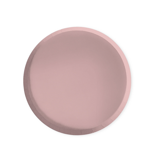Round pink paper plate on a white background