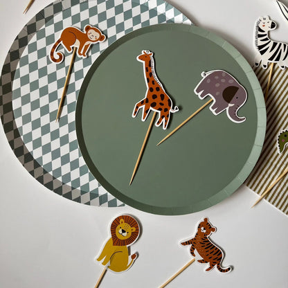 Animal-themed paper cupcake toppers with a green plate and checkered plate.